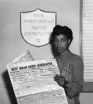 Una Marson reading the paper