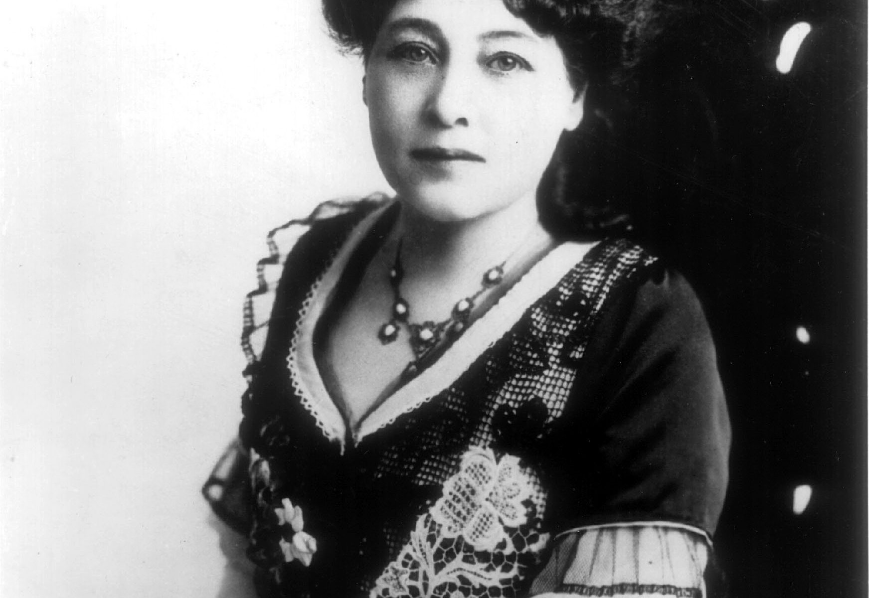 Alice Guy in an ornate chair
